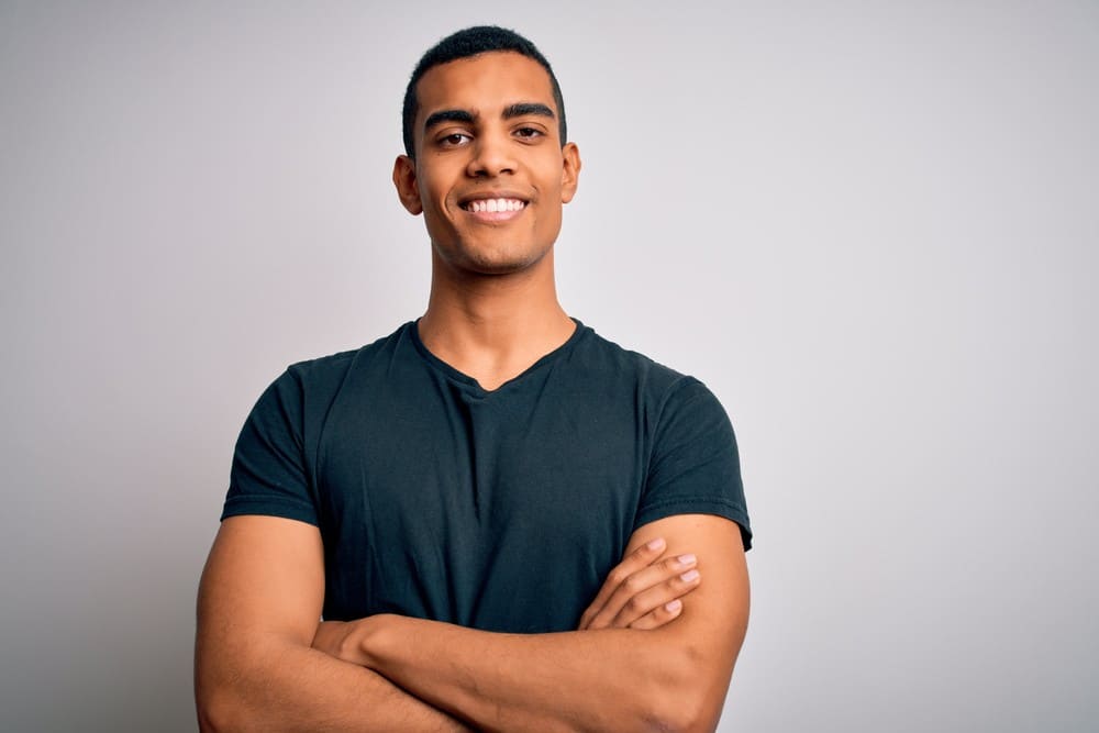 Young,Handsome,African,American,Man,Wearing,Casual,T-shirt,Standing,Over